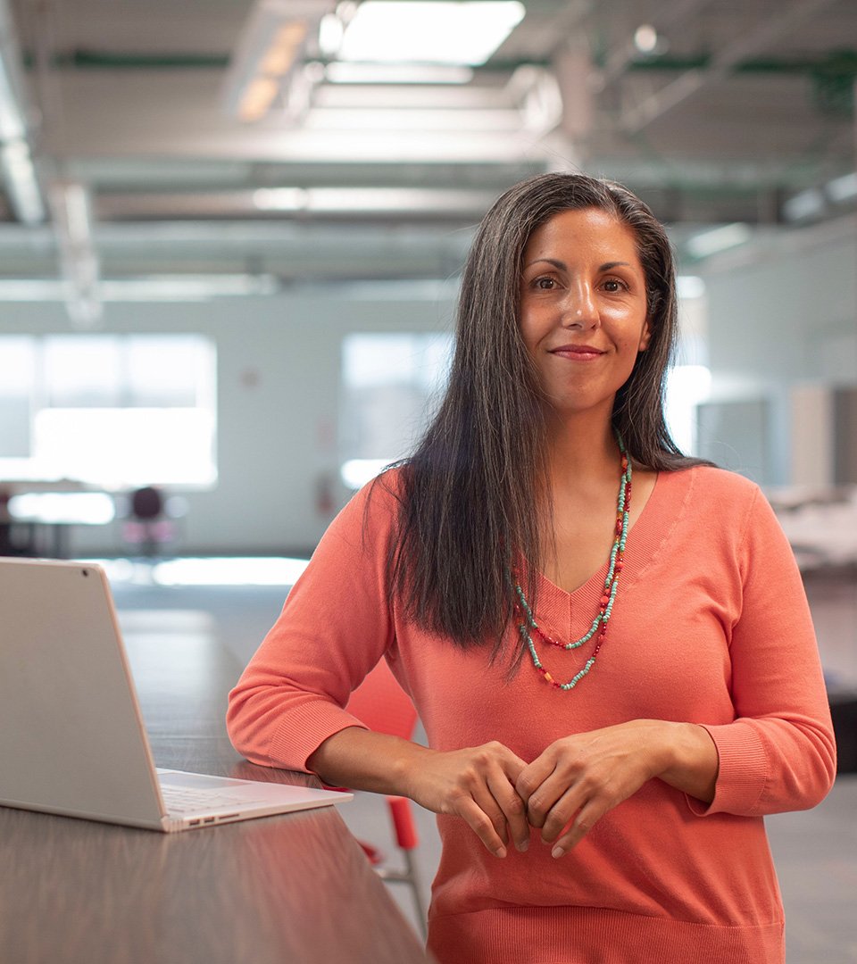 Woman Standing at a Desk